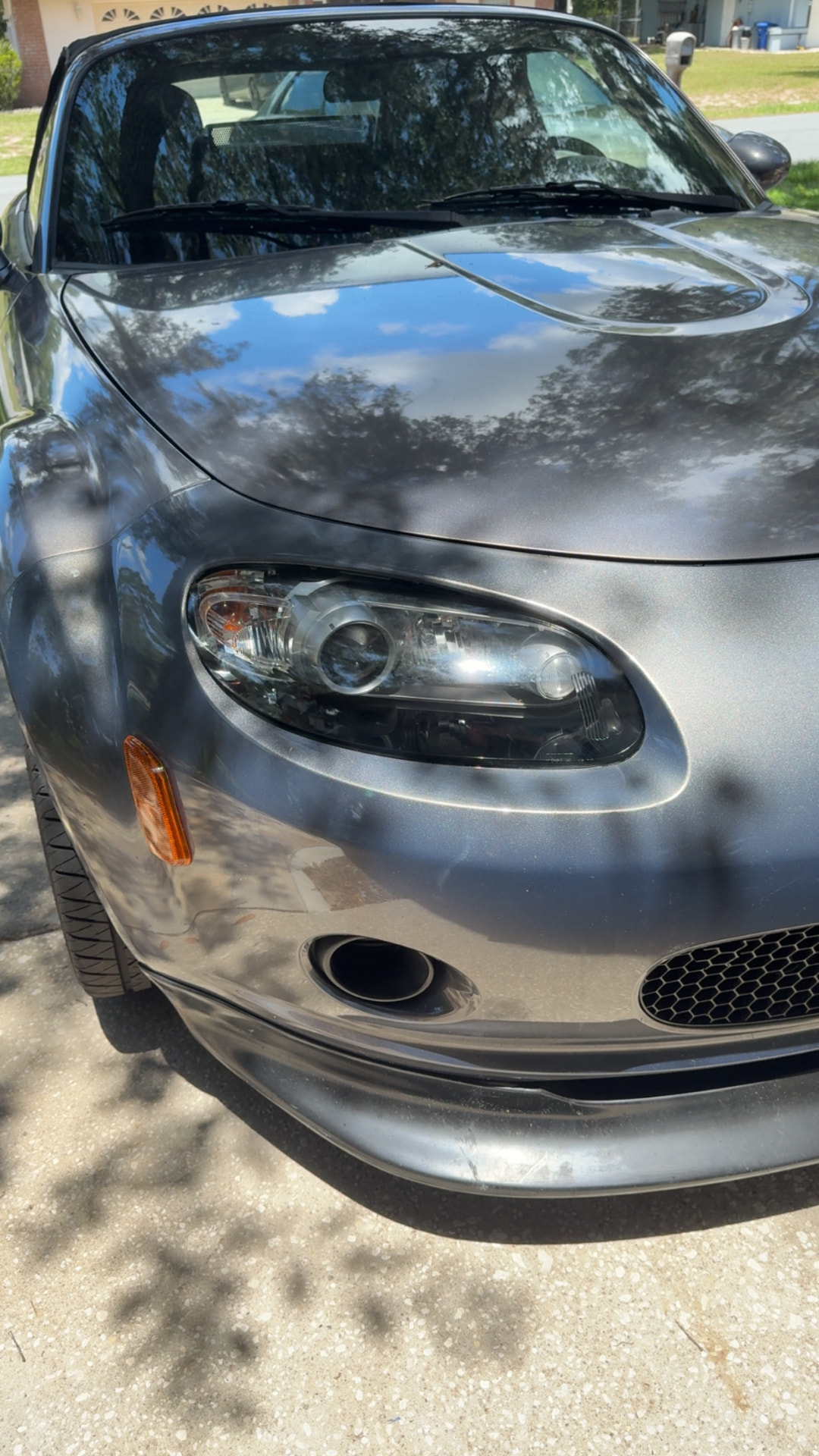 Mazda MX-5 Miata headlight restored to a clear finish after Crystal Clear headlight restoration in Citrus County FL